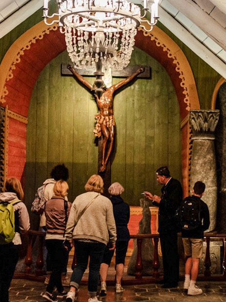 Tour group observing chapel interior at Wieliczka Salt Mine.