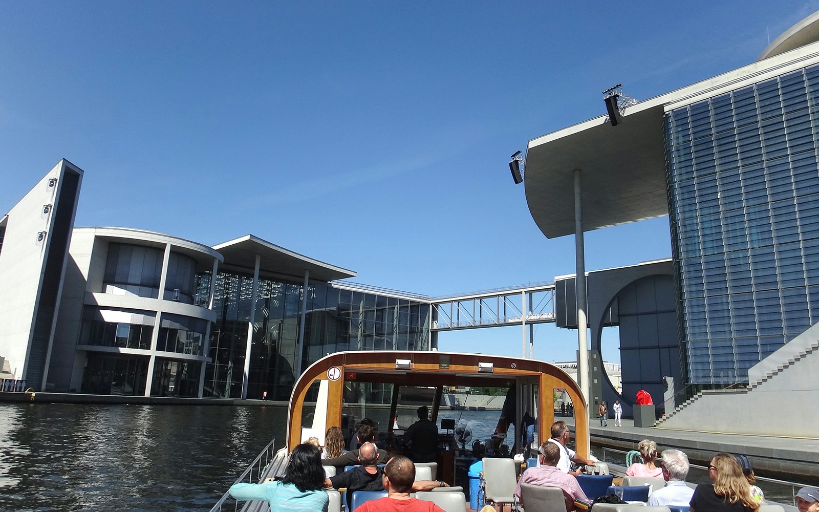 Berlin sightseeing cruise passing modern architecture near Hackescher Markt.