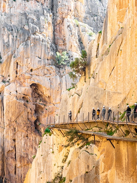 Visitors walking along the Caminito del Rey pathway in Málaga, Spain.
