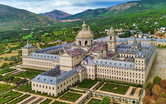 El Escorial monastery complex with gardens in San Lorenzo de El Escorial, Spain.