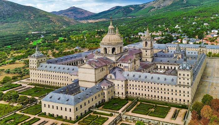 El Escorial monastery complex with gardens in San Lorenzo de El Escorial, Spain.