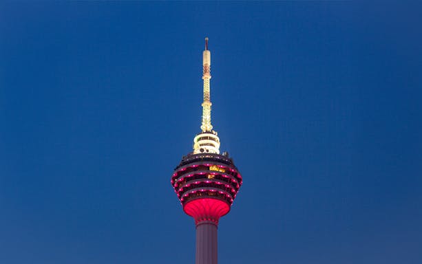 KL Tower illuminated at night for New Year Eve celebration in Kuala Lumpur.