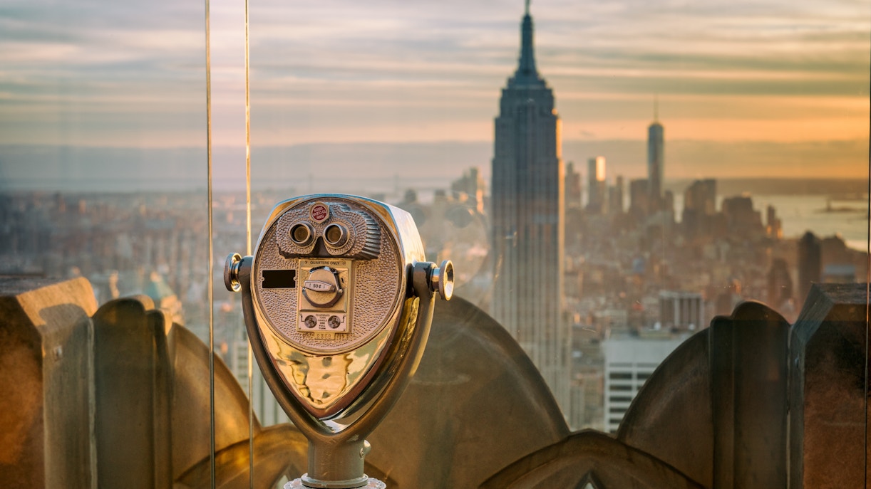 Viewing binoculars overlooking the Empire State Building from Top of the Rock, New York.