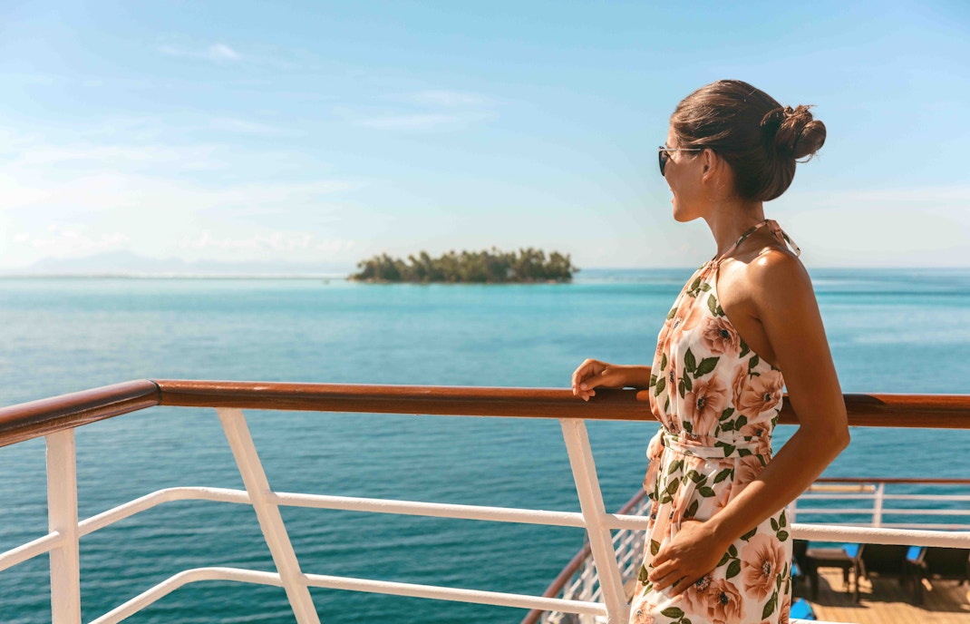 Woman looking at nile river from cruise