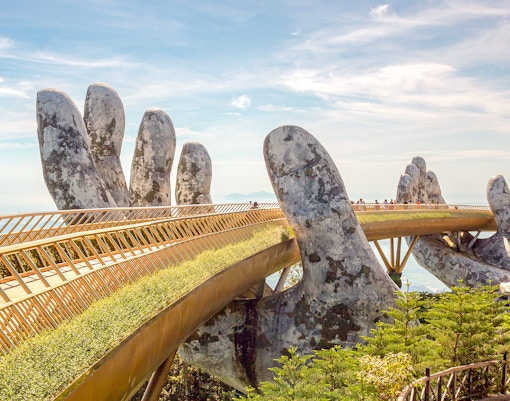 Golden Bridge at Sun World Ba Na Hills, Vietnam, with scenic mountain views.