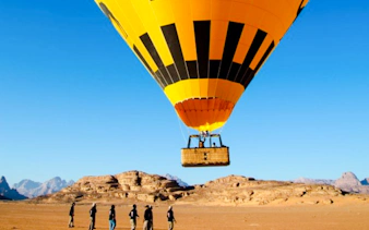 Hot air balloon preparing for flight in Wadi Rum desert, Jordan.