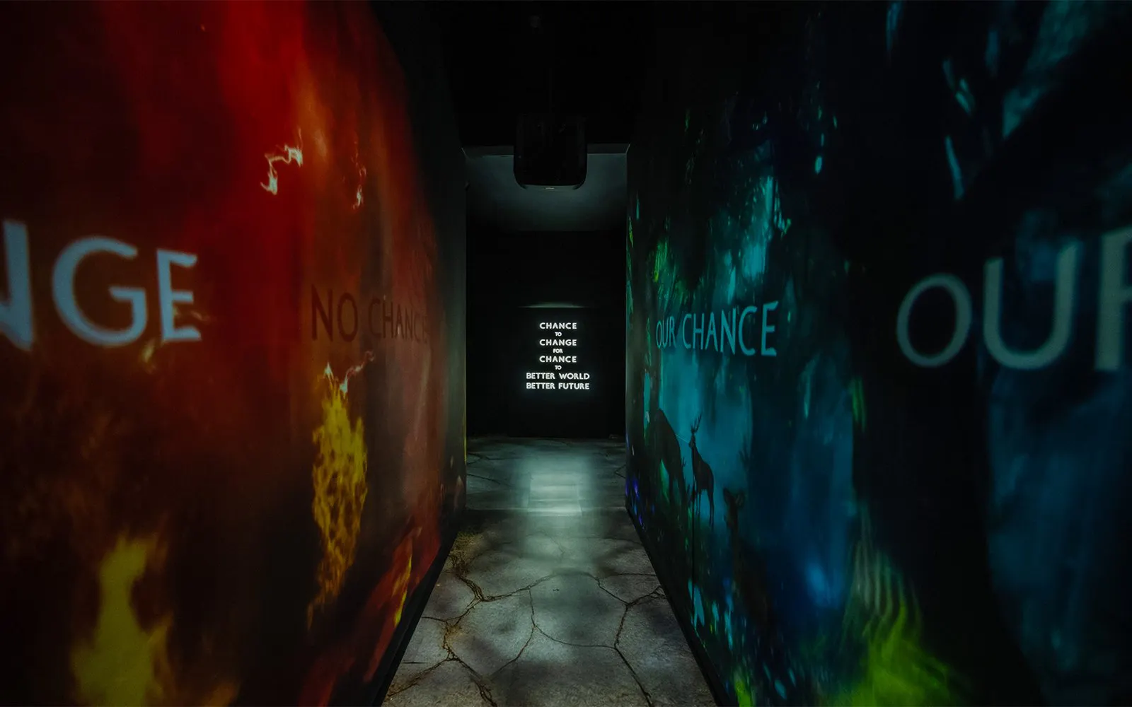 Immersive panels with "Chance to Change" message at Better World Better Future exhibit.