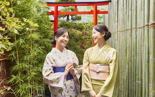 Women in colorful kimonos at Tokyo Maikoya Tea Ceremony, Japan.