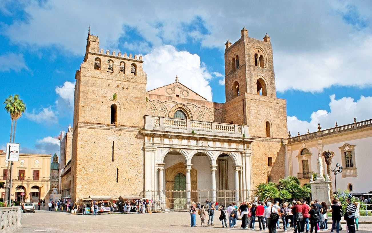 Great Cathedral of Monreale with tourists in the foreground, Sicily, Italy.