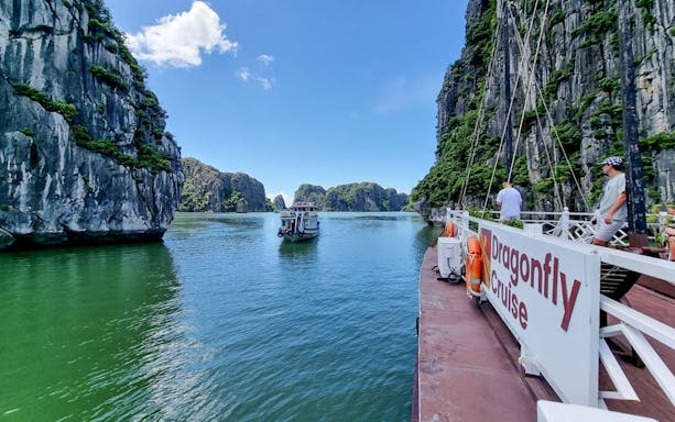 Ha Long Bay limestone karsts and emerald waters on a 3-star cruise, Vietnam.