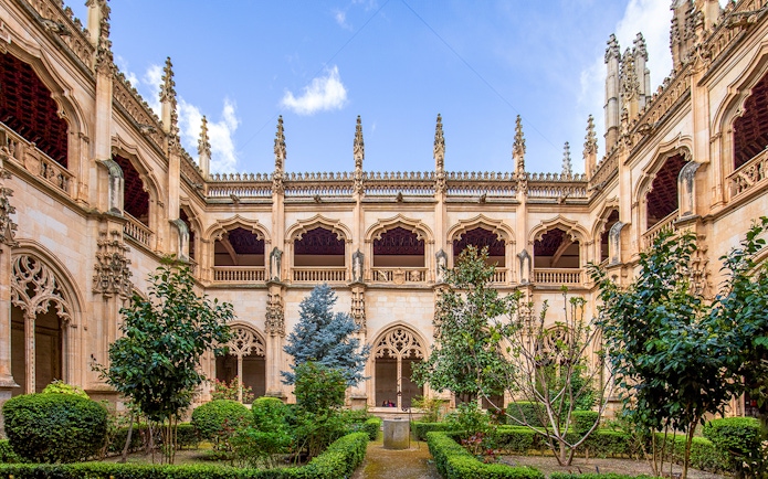 San Juan de los Reyes Monastery courtyard with Gothic arches, Toledo.