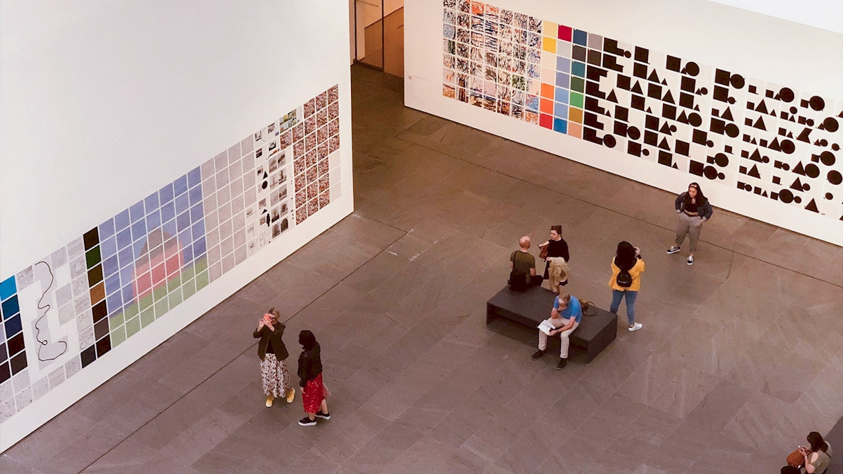 Visitors viewing modern art installations at MoMA, New York City.