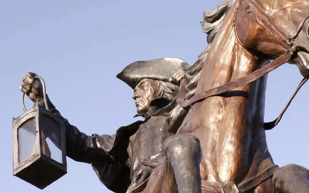 Statue of a historical figure on horseback holding a lantern, Boston Greenway.