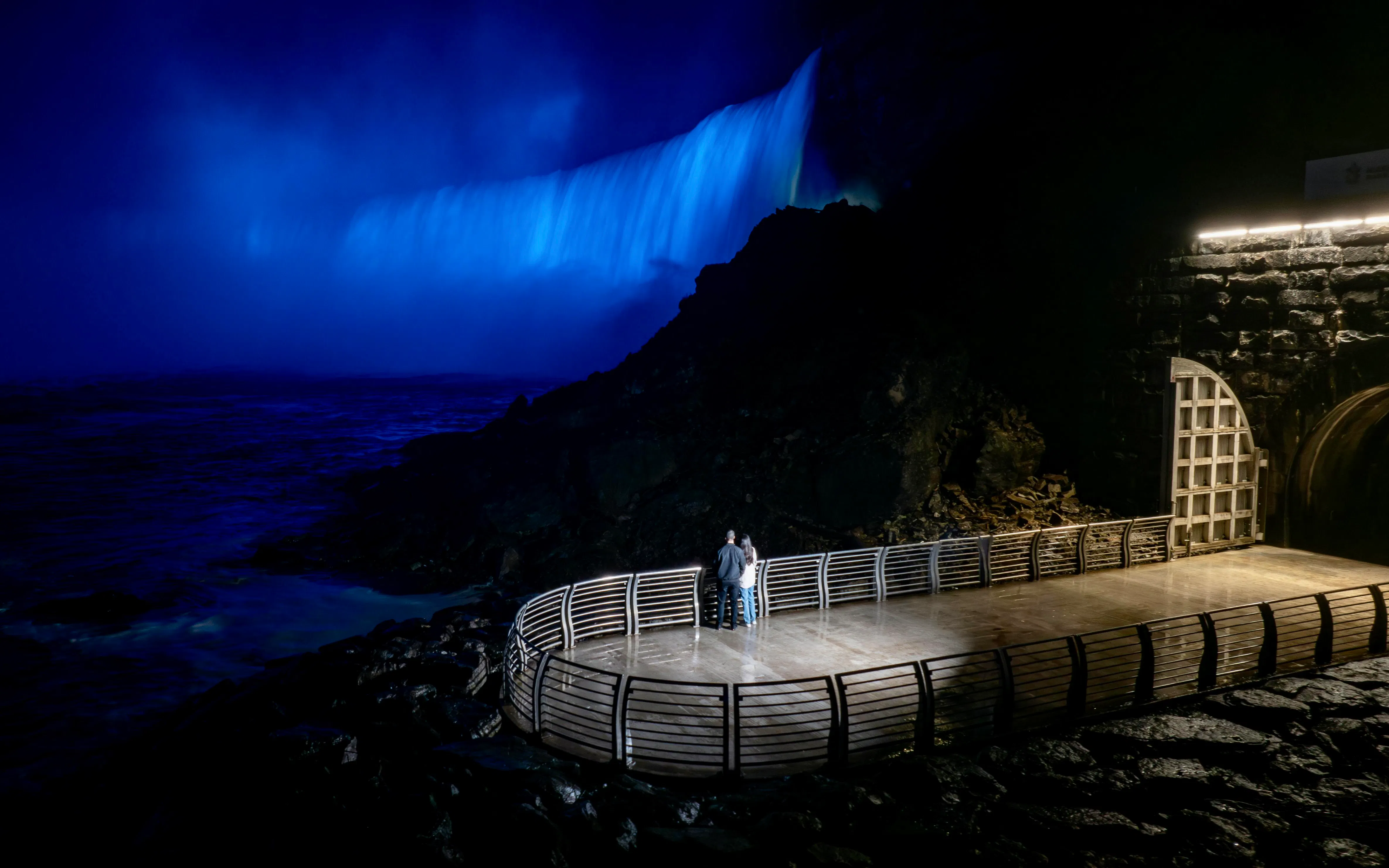 Viewing platform at Niagara Parks Power Station illuminated at night.
