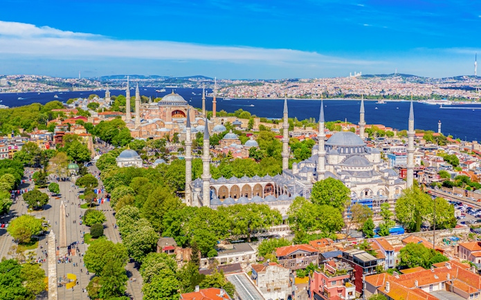 Hagia Sophia and Blue Mosque in Sultanahmet district, Istanbul, with Bosphorus in background.