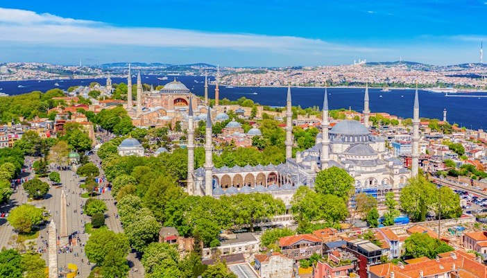 Hagia Sophia and Blue Mosque in Sultanahmet district, Istanbul, with Bosphorus in background.