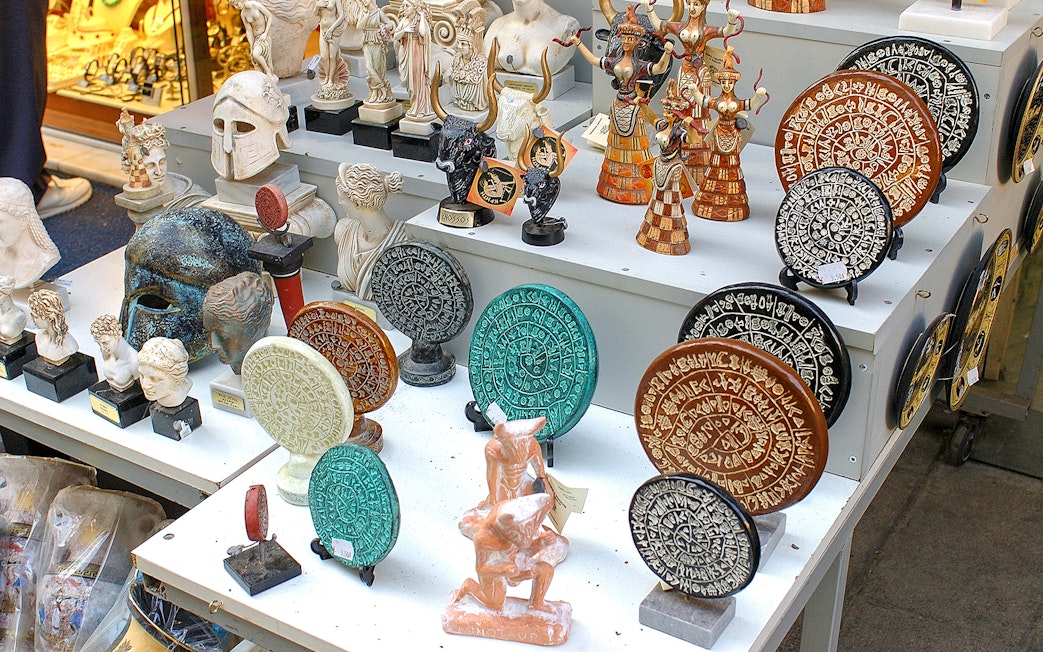 Souvenirs depicting ancient Greek artifacts at Knossos Palace site.