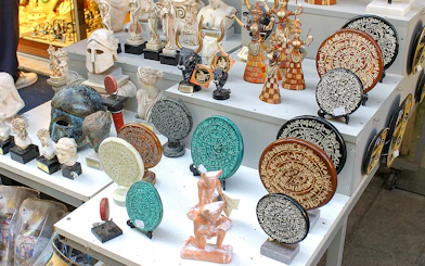 Souvenirs depicting ancient Greek artifacts at Knossos Palace site.