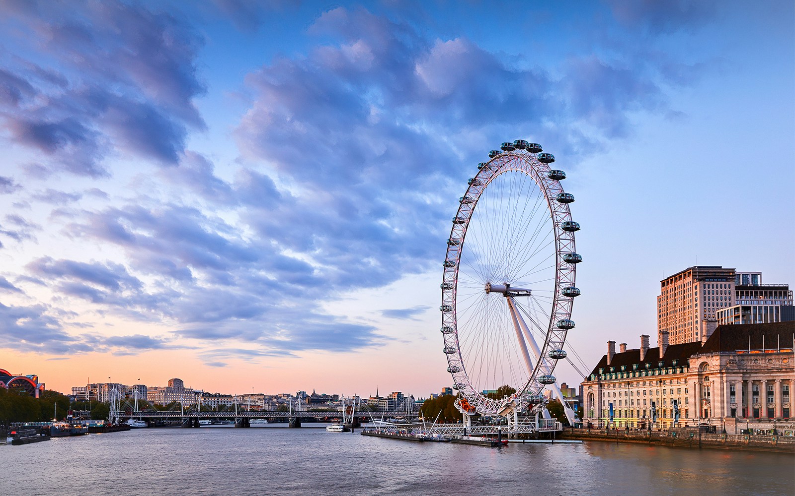 Tower of London with Crown Jewels and London Eye view, showcasing iconic London attractions.