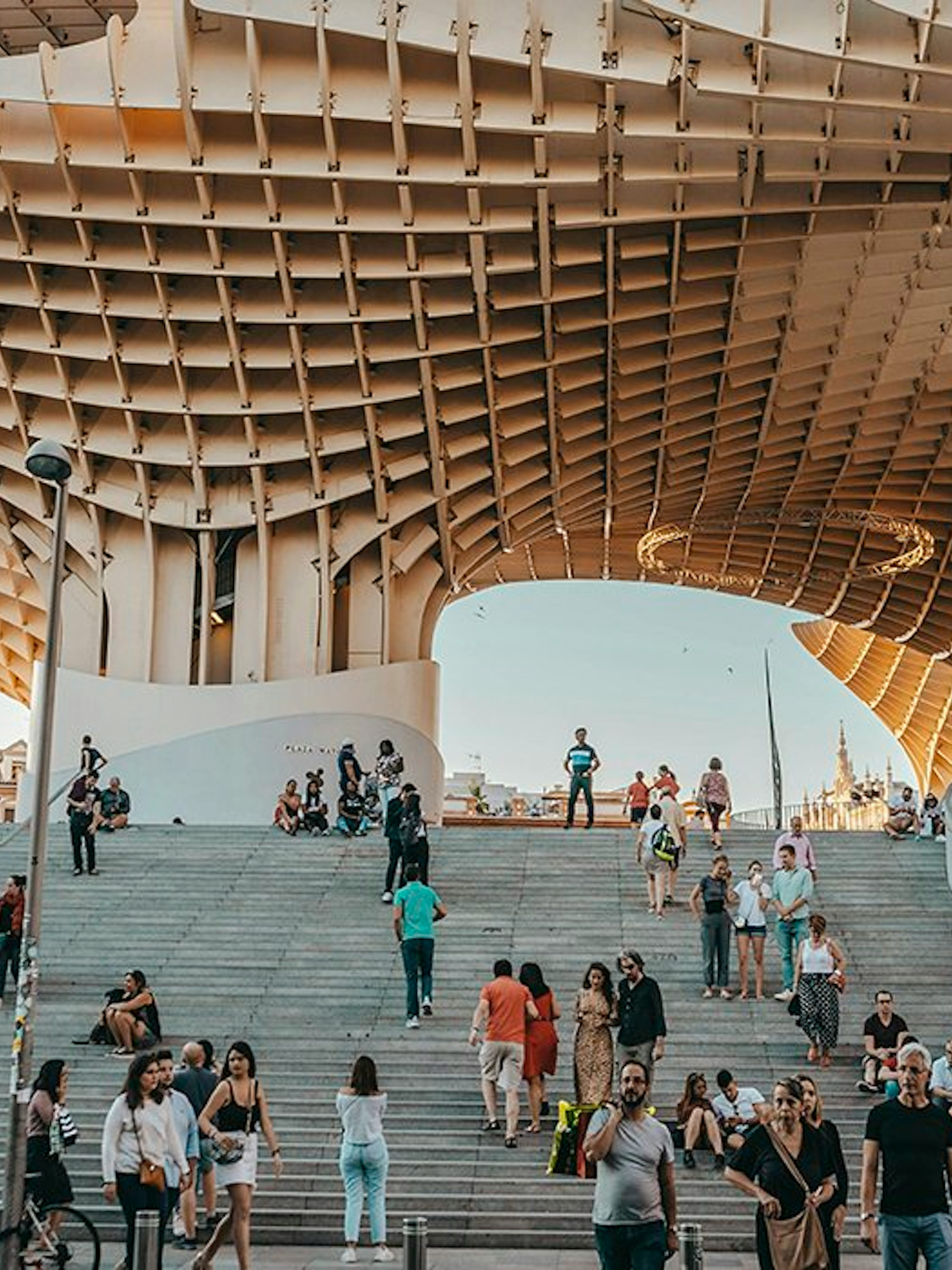 Tourists exploring Setas de Sevilla during a city guided tour.