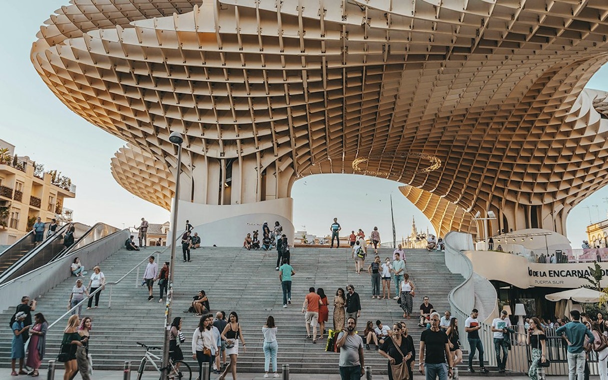 Tourists exploring Setas de Sevilla during a city guided tour.