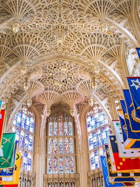 Lady Chapel ceiling and colorful banners at Westminster Abbey, London.