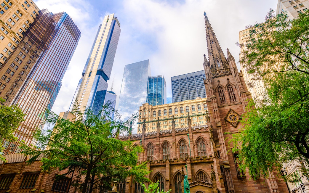 Trinity Church with skyscrapers in lower Manhattan, New York City.
