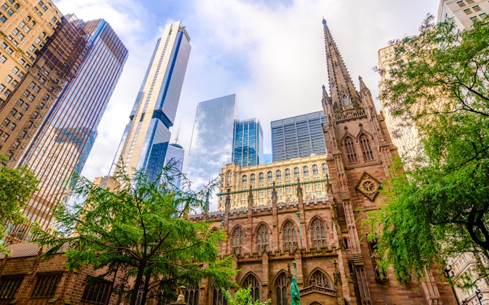 Trinity Church with skyscrapers in lower Manhattan, New York City.