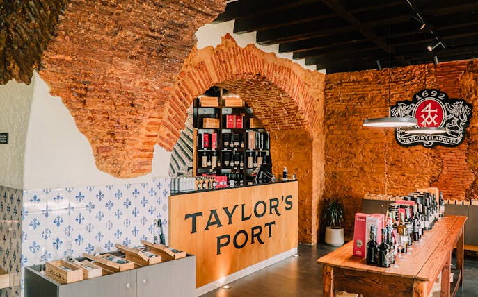 Taylor's Port wine shop interior with tasting table, Portugal.