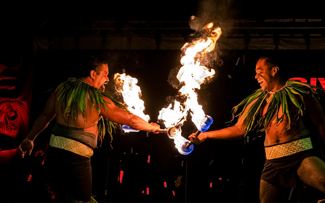 Fire dancers performing at Moana Luau, Hawaii.