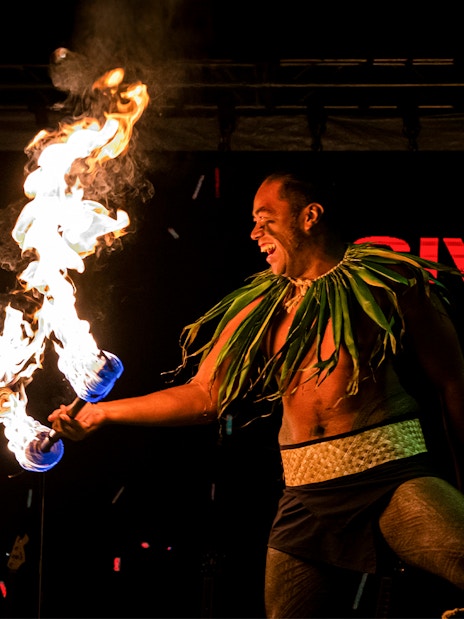 Fire dancers performing at Moana Luau, Hawaii.