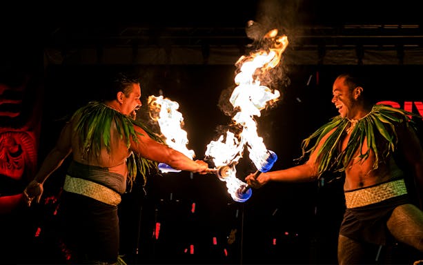 Fire dancers performing at Moana Luau, Hawaii.
