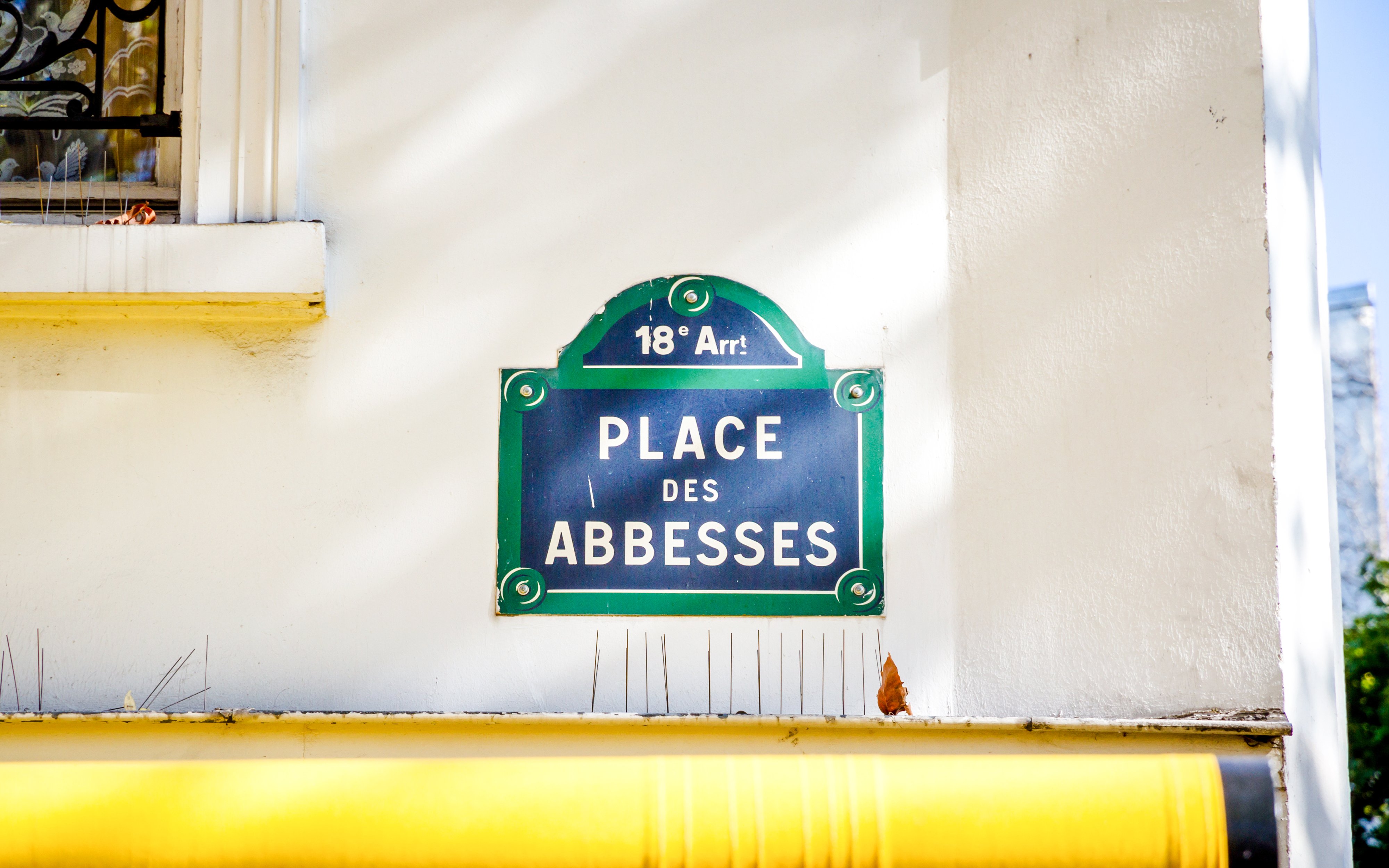 Place des Abbesses street sign in Montmartre, Paris.