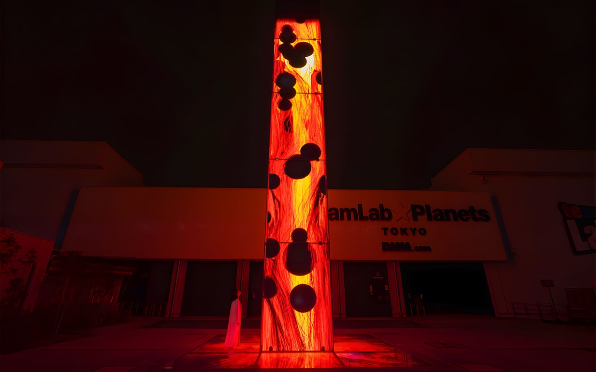 Entrance to teamLab Planets Tokyo with illuminated art installation.