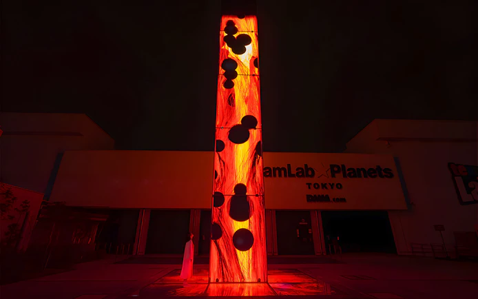 Entrance to teamLab Planets Tokyo with illuminated art installation.
