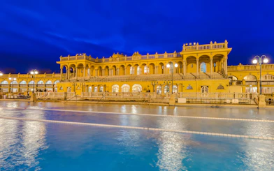 Szechenyi Thermal Bath illuminated at night in Budapest, Hungary.