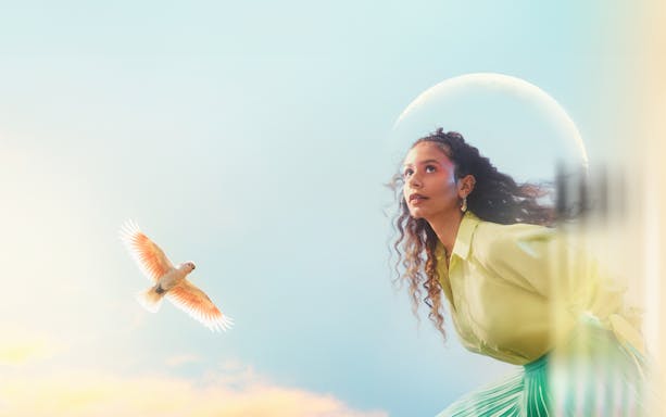 The Magic Flute performance at Sydney Opera House with a woman gazing upward and a bird in flight.