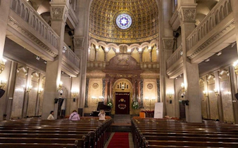 Synagogue interior with ornate ceiling and stained glass in Buenos Aires, part of Jewish Heritage Tour.