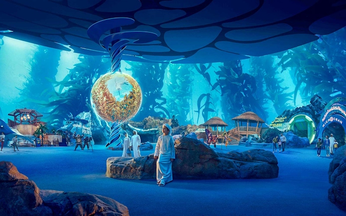 Visitors exploring underwater-themed exhibits at SeaWorld Abu Dhabi.