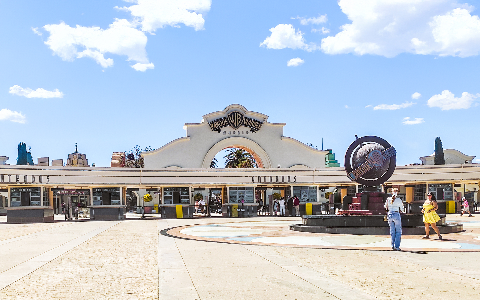 Parque Warner entrance with iconic cartoon character statues, Madrid, Spain.