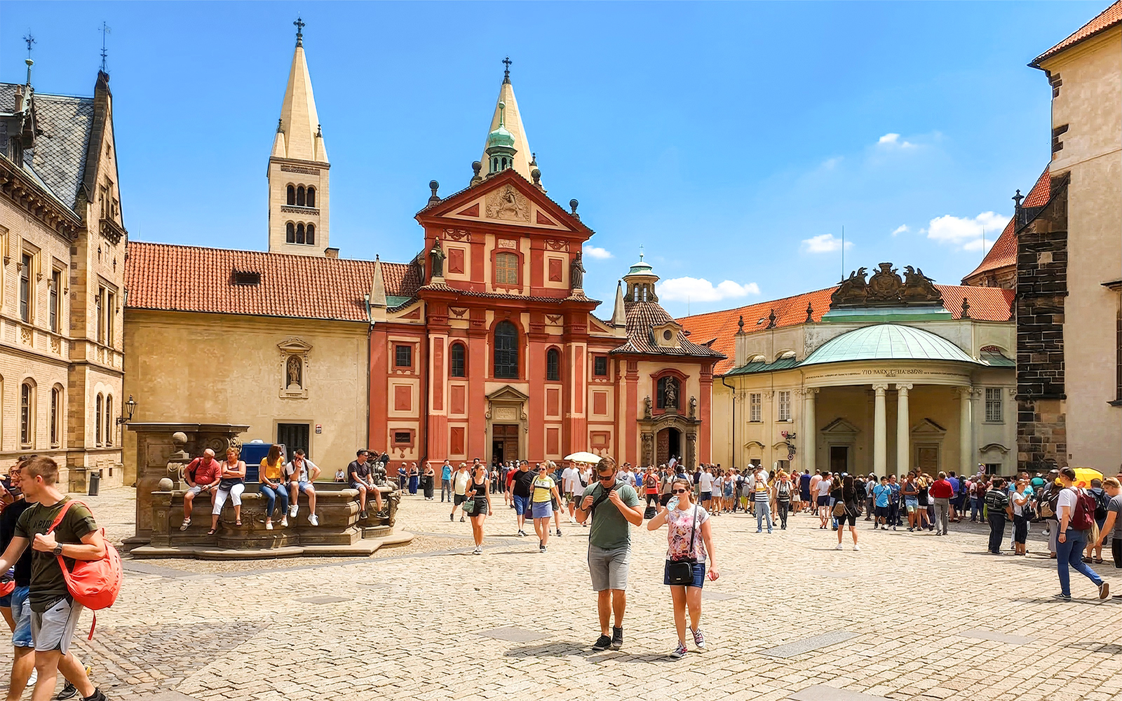 Prague Castle courtyard with tourists during a walking tour.