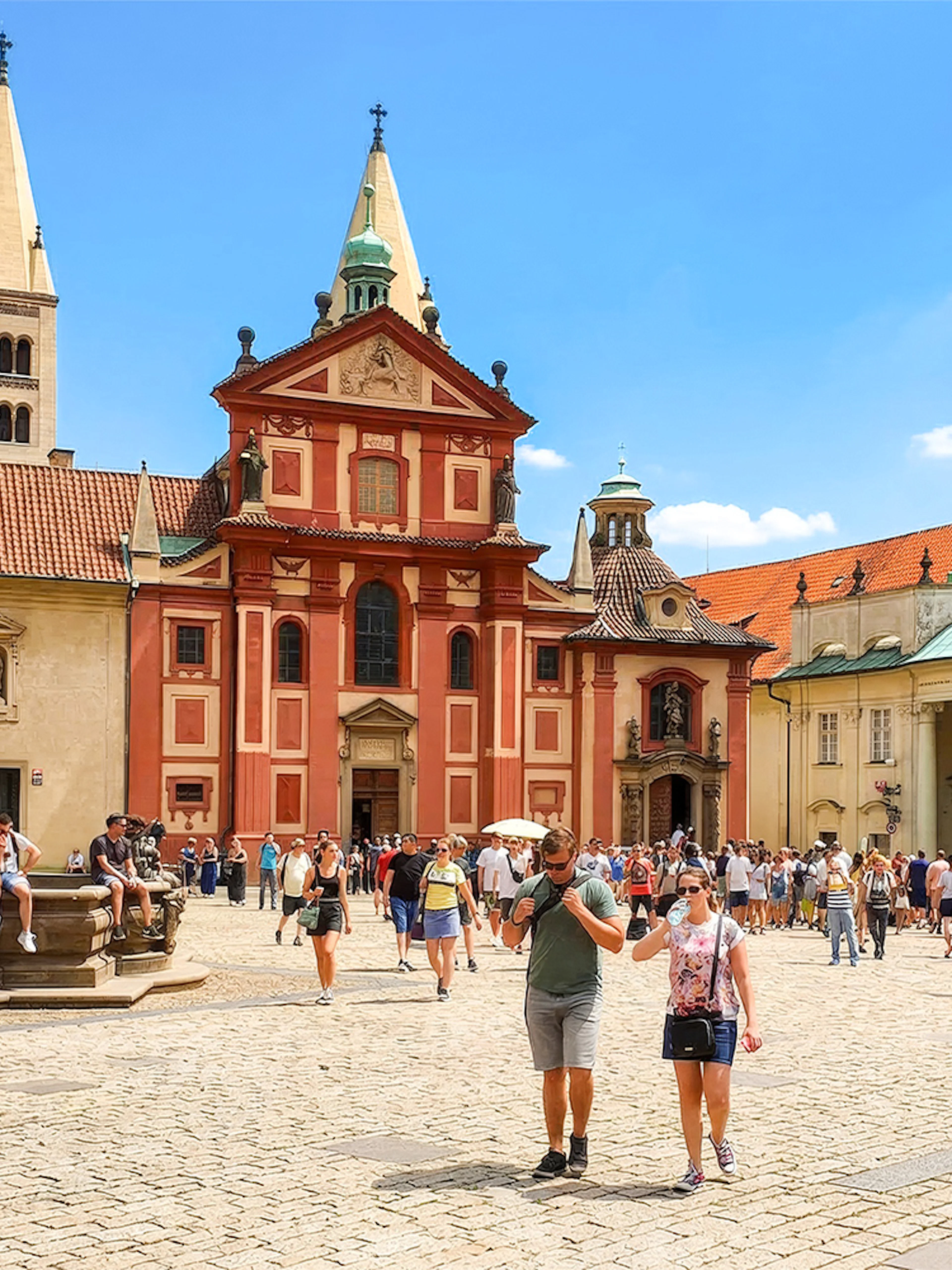 Prague Castle courtyard with tourists during a walking tour.