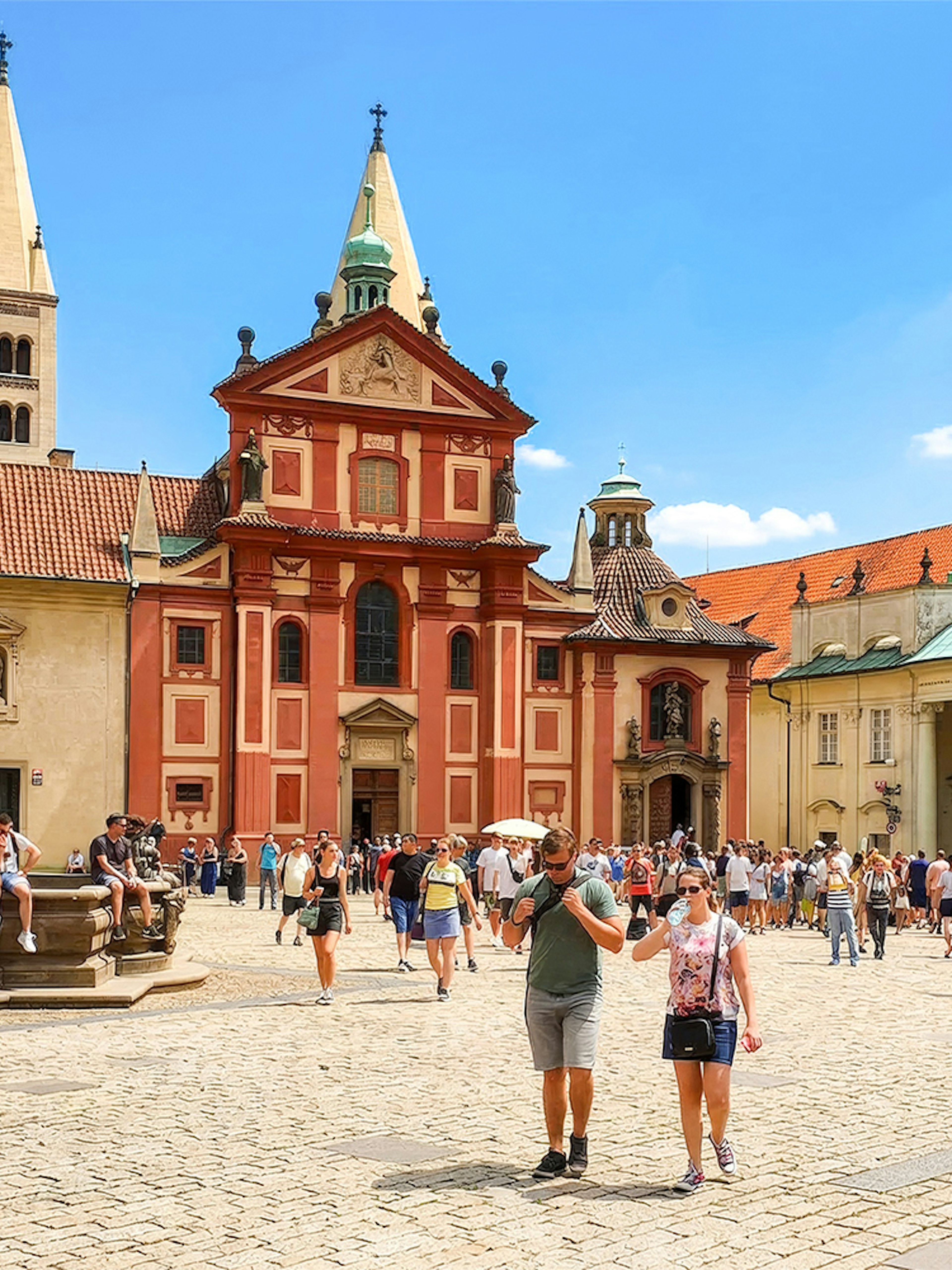 Prague Castle courtyard with tourists during a walking tour.