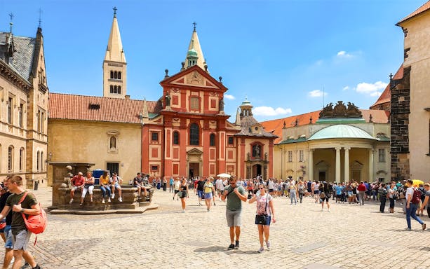 Prague Castle courtyard with tourists during a walking tour.