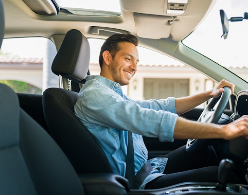 Driver using GPS navigation in car to reach Kuranda Village.