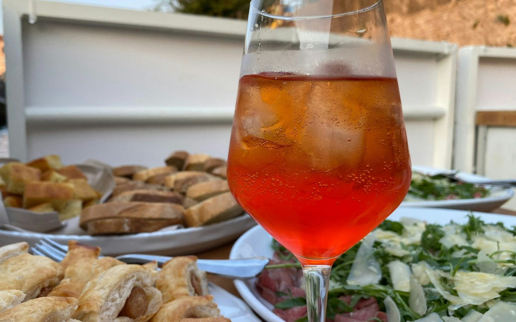 Aperitif with snacks on Navigli canal cruise in Milan.