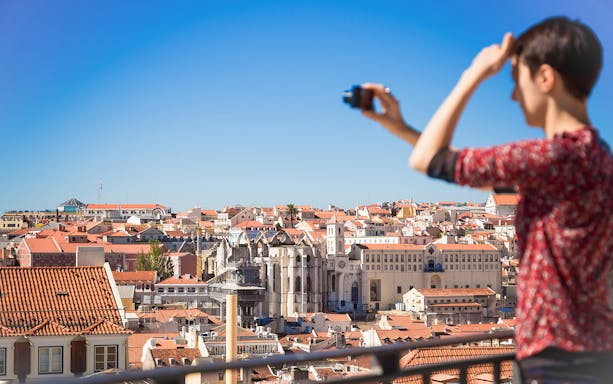 Lisbon cityscape view with Carmo Convent during guided walking tour.