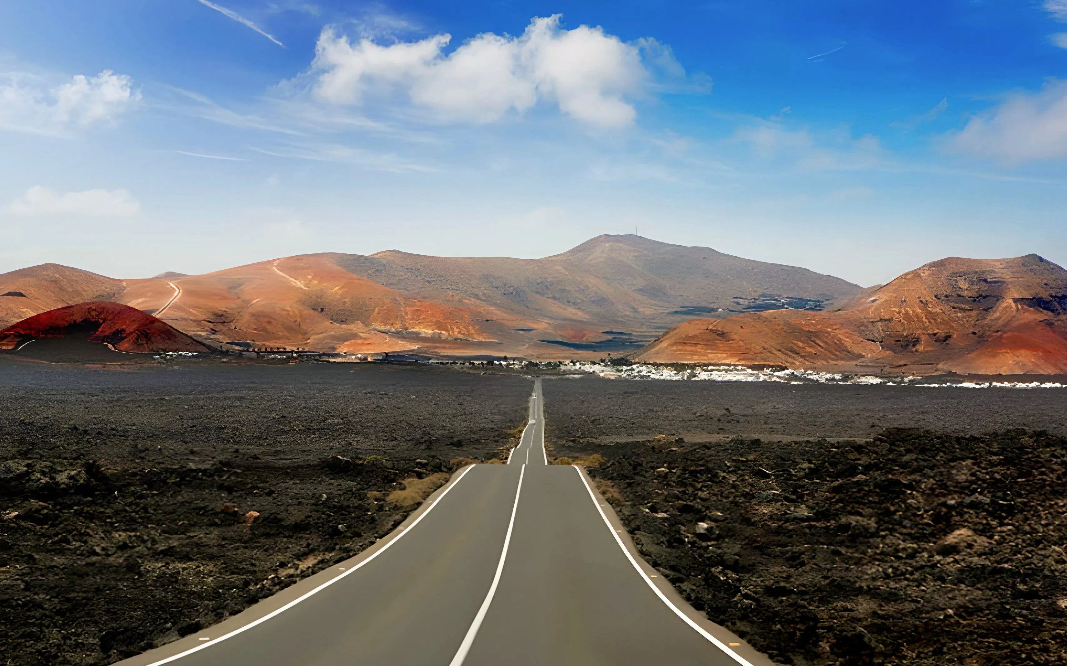 Road through volcanic landscape at Timanfaya National Park, Lanzarote.