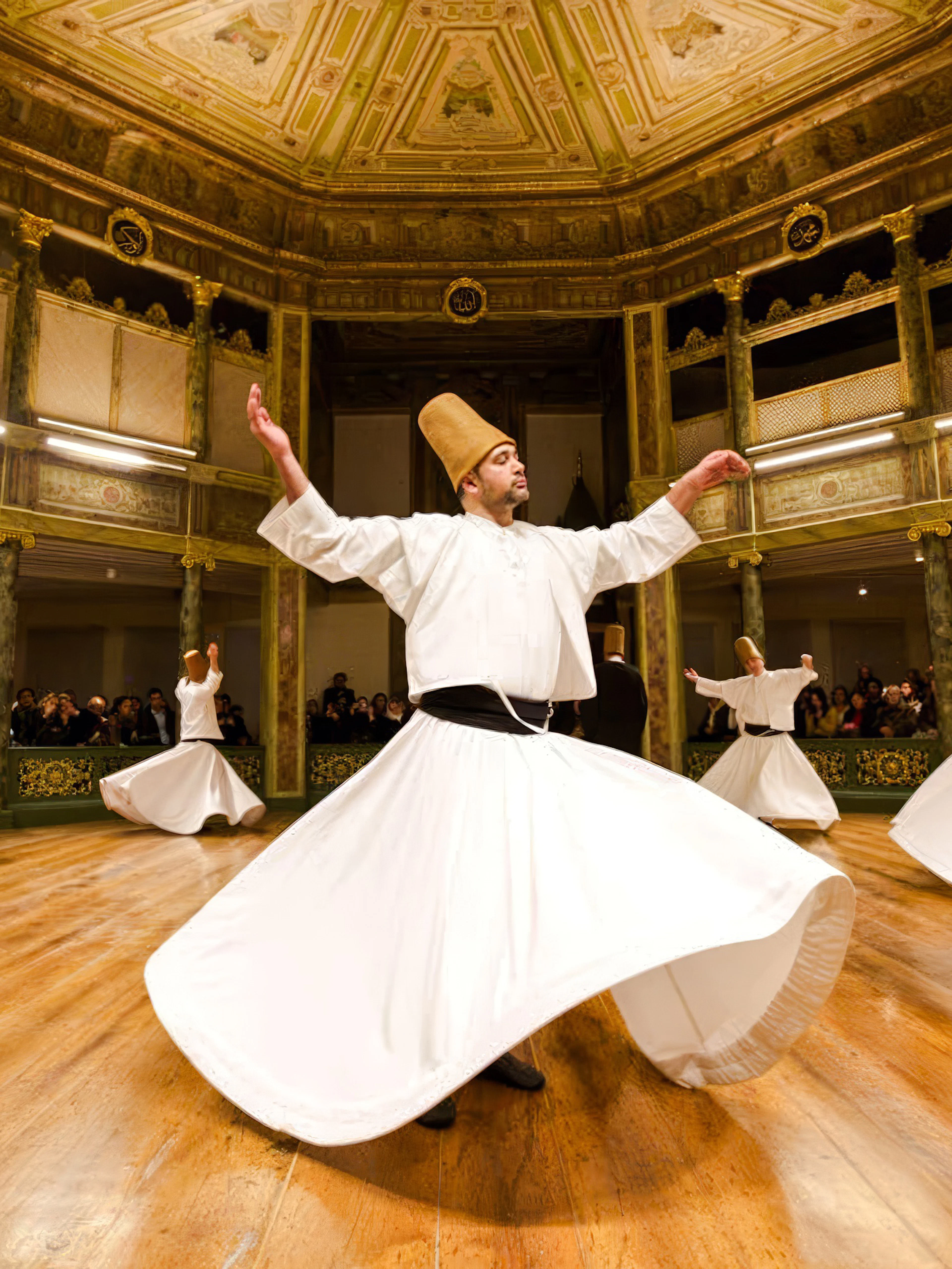 Whirling Dervishes performing in a historic Istanbul venue.
