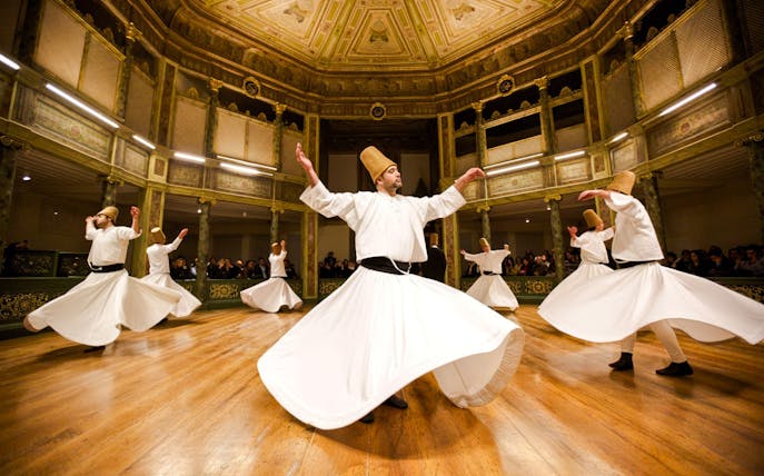 Whirling Dervishes performing in a historic Istanbul venue.